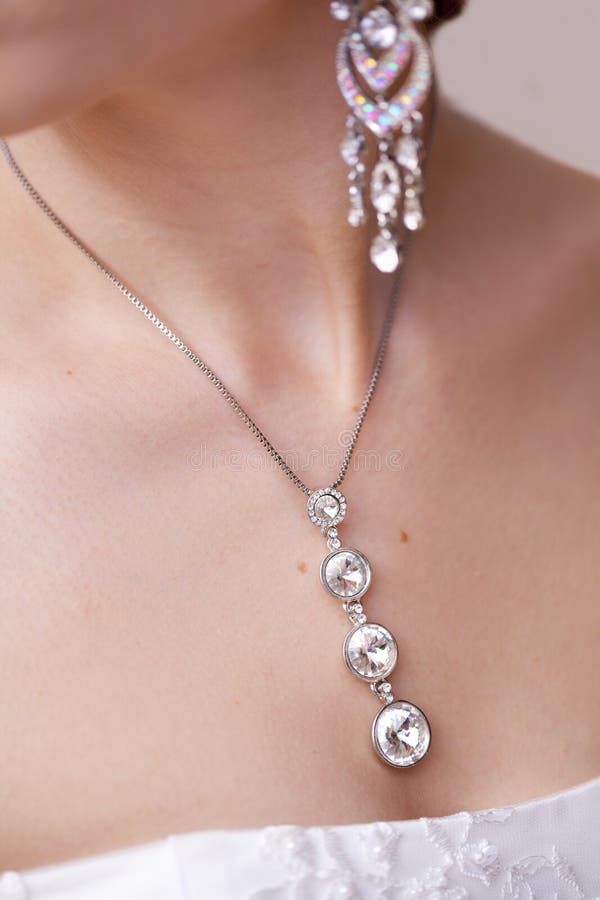 Silver Necklace with Big Rhinestones on Neck and Breast of Girl