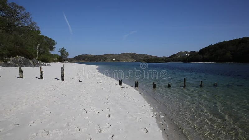 Silver Sands of Morar beautiful white sandy beach in Scotland clear turquoise sea on the coastline from Arisaig to Morar