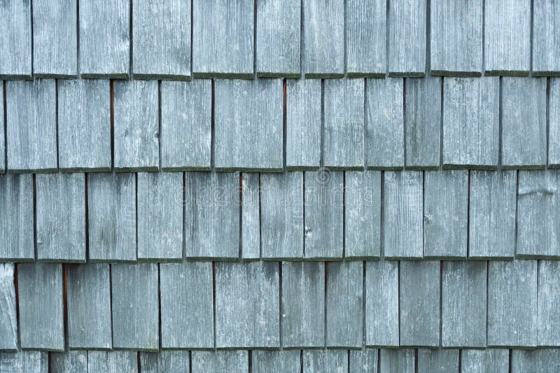 Old Uneven Shingles Roof with Blur Effect in Navy Blue Tone. Stock