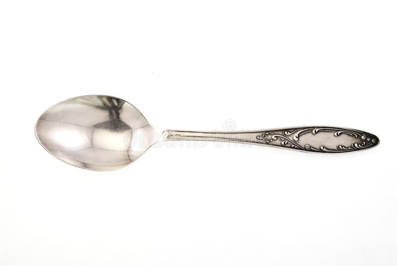 Silver spoon on white background