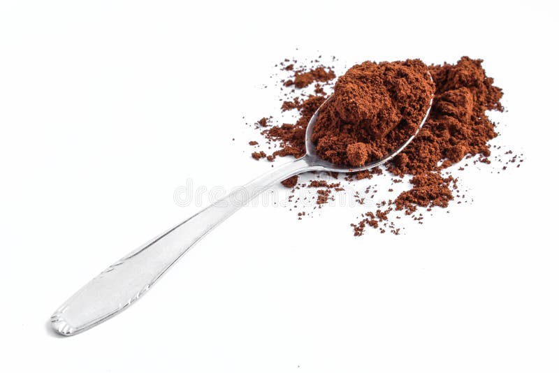 Teaspoon Full of Tea Leaf on a Wooden Table. Black Tea in a Spoon Stock