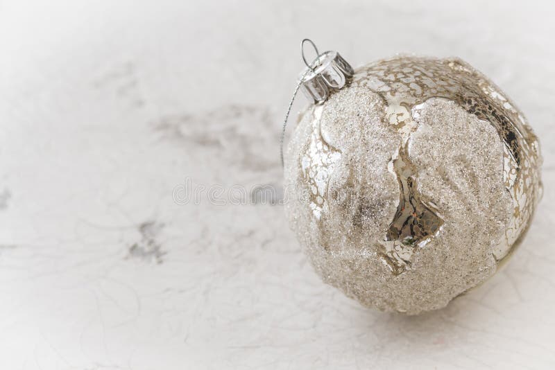 Silver textured christmas bauble on white patterned background stock photos