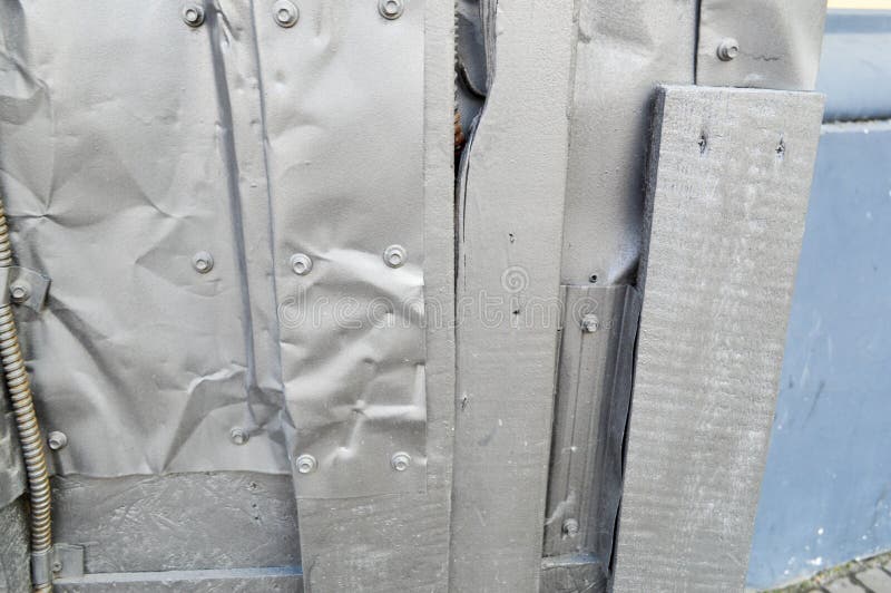 Silvery texture in steampunk style, cyberpunk bent, twisted, old metal sheets of tin, bolts, rivets, iron rods. The background