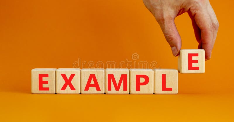 Simbol exemplu. concept word example on wood cubes. fundal portocaliu pentru o masă portocalie de culoare portocalie frumoasă, spa stock image
