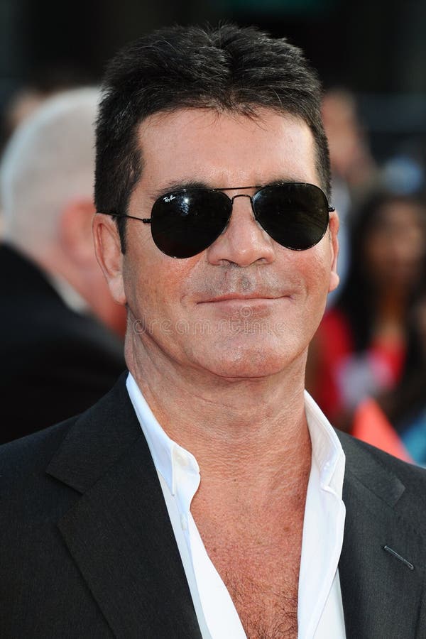 Simon Cowell arriving for the "One Direction: This is Us" World premiere at the Empire, Leicester Square, London. 20/08/2013 Picture by: Steve Vas / Featureflash. Simon Cowell arriving for the "One Direction: This is Us" World premiere at the Empire, Leicester Square, London. 20/08/2013 Picture by: Steve Vas / Featureflash