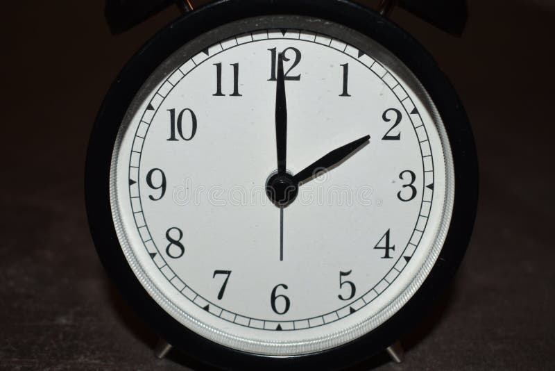 Clock Pointing To Different Times Stock Photo Image of background