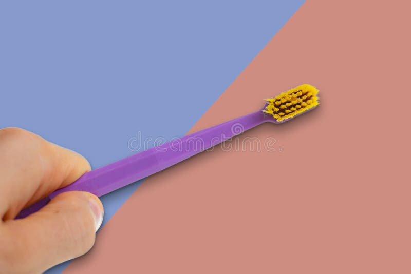 A simple color toothbrush isolated on white background stock photography