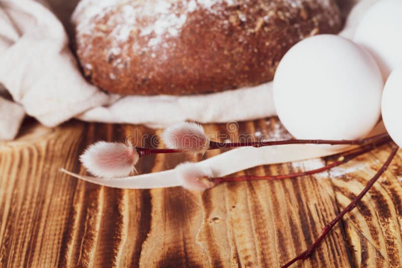 Simple Easter Rustic Background with a Willow Twig, White Chicken Eggs