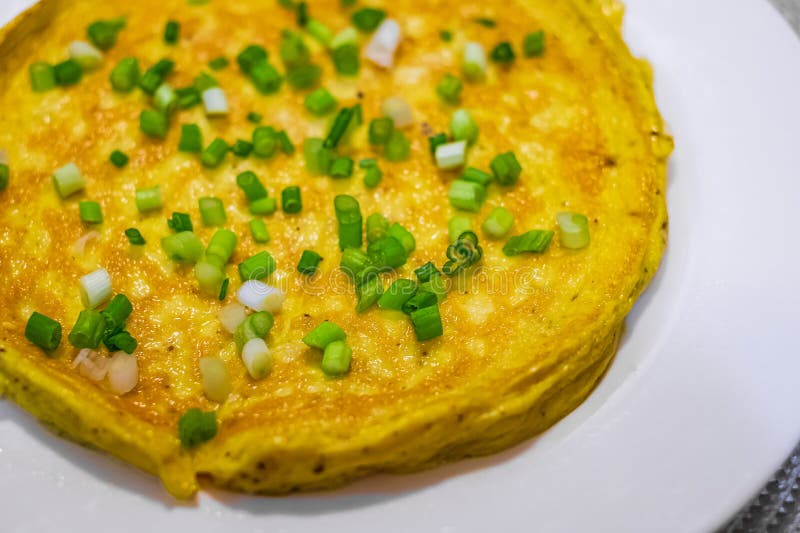 Simple Egg Omelette with Herbs. Fluffy Breakfast Omelette with Green