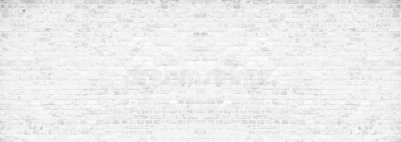 Simple grungy white brick wall with light gray shades pattern surface texture background in wide panorama banner format