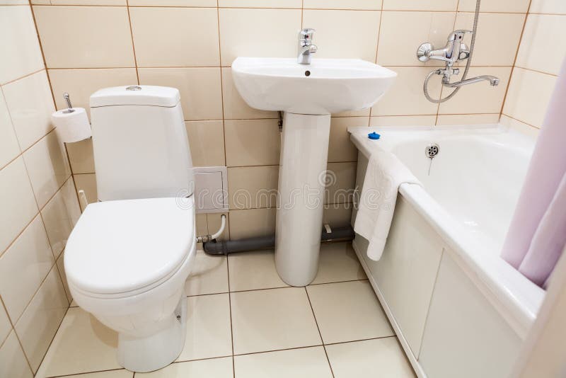 Simple Half Bathroom with Toilet, Sink and Bath with Shower, White