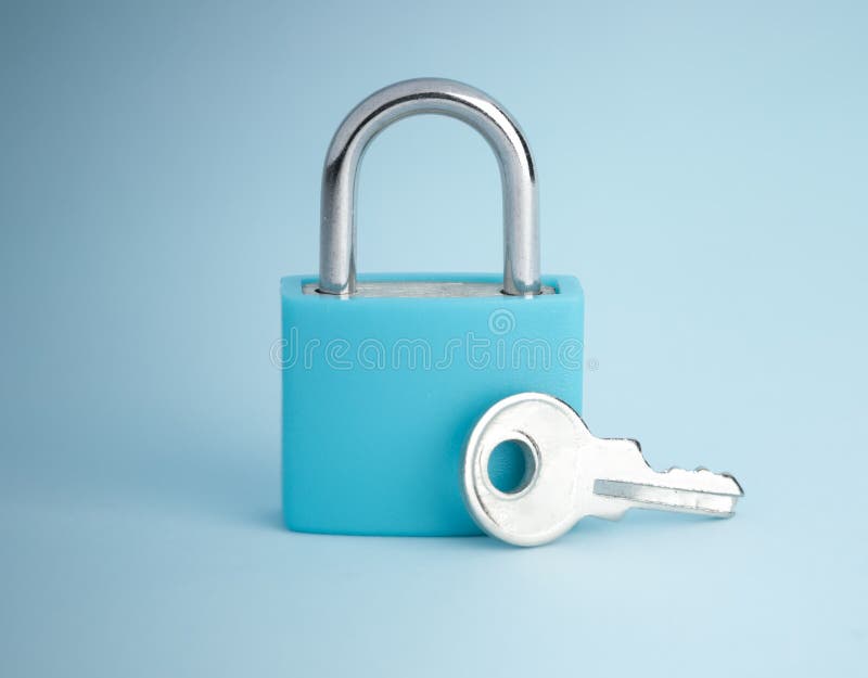 Simple lock and key. Small padlock with small shiny key. Business data encryption, home security, or other safeguarding metaphor stock images