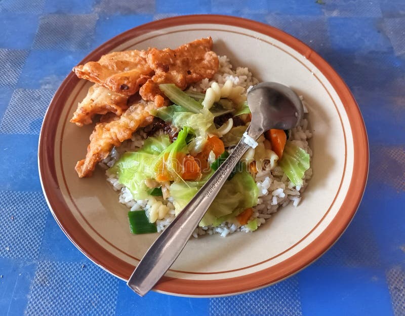 A Simple Lunch Menu with Rice, Carrot, Cabbage Vegetable Soup with a