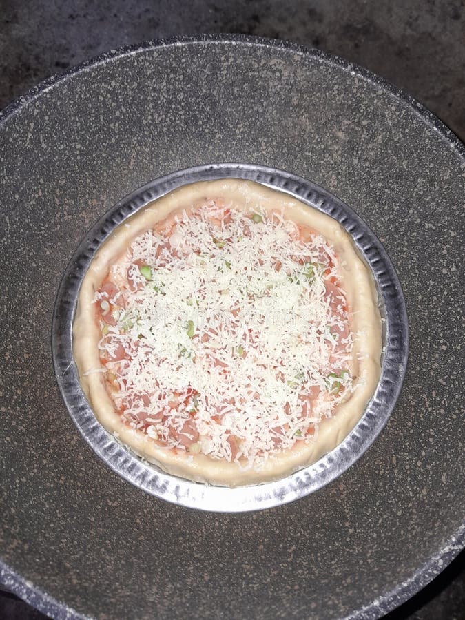 Simple pizza cooked using a Teplon without an oven stock photos