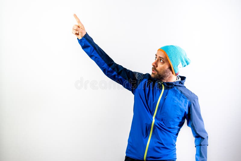 Simple portrait and white background, of a mountaineer man ready to start a challenge in nature royalty free stock photos