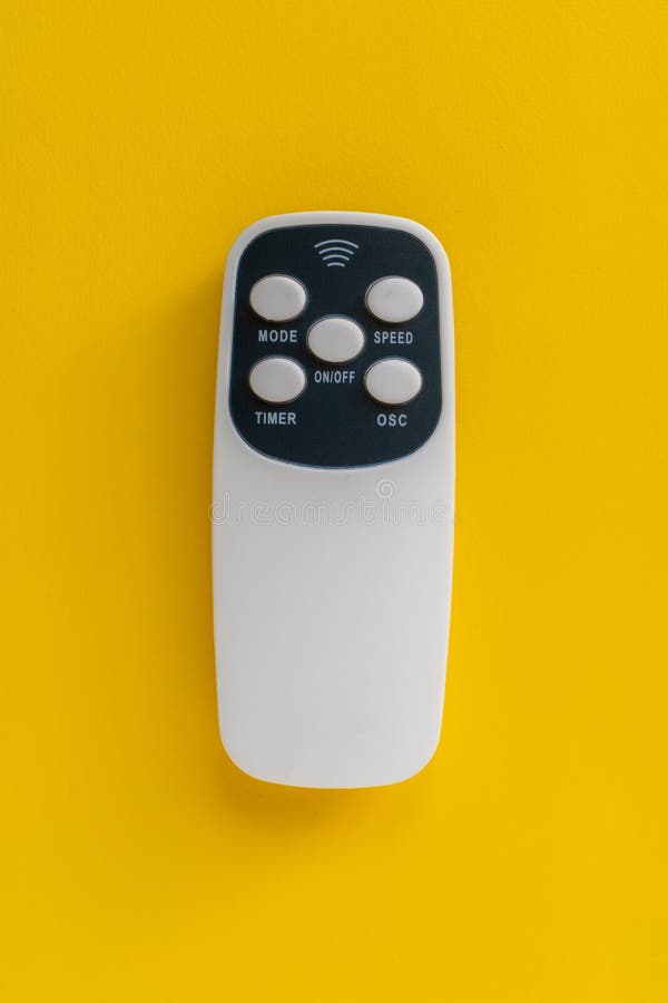 Simple remote wireless controlle on the color background isolated top view