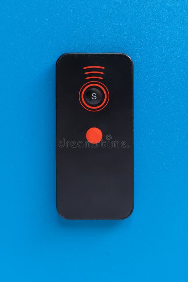 Simple remote wireless controlle on the color background isolated top view