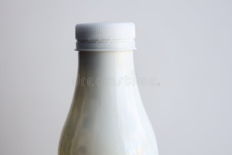 A simple setup with a bottle of milk placed on a table, ready for use royalty free stock images