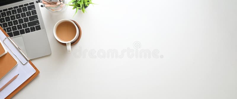 Simple Top view table - Creative flat lay office desk. Laptop, notebooks and coffee cup on white background.