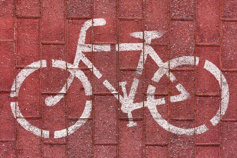Sinal branco de bicicleta em ciclovia imagens de stock