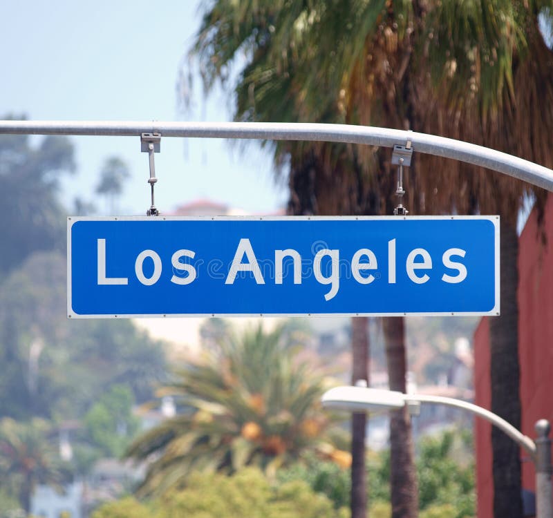 Los Angeles street sign with palm trees in Southern California. Los Angeles street sign with palm trees in Southern California.