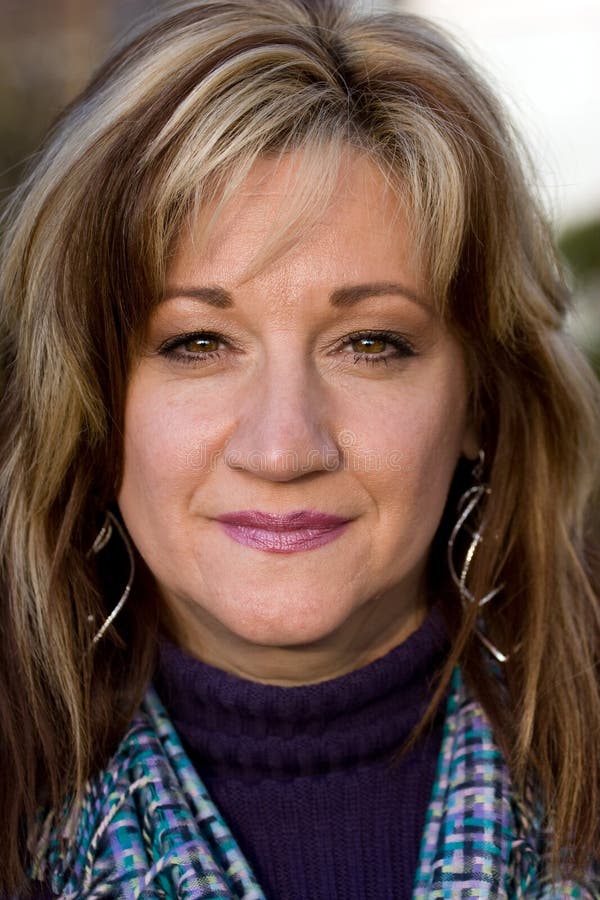 A pretty middle aged woman with a very sincere smile. Smiling asking stock images, royalty-free photos and pictures
