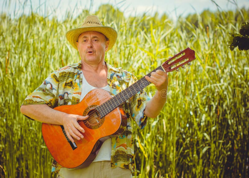 Funny Older Man in Print Shirt Tourist Playing Guitar Stock Image - Image  of mature, ethnicity: 219986875