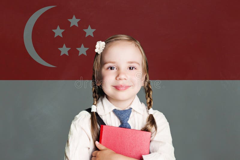 Singapore concept with happy child girl in school uniform with book against the Republic of Singapore flag background royalty free stock photography Singapore concept with happy child girl in school uniform with book against the Republic of Singapore flag background royalty free stock photography