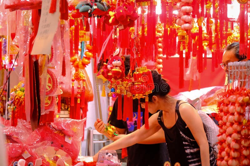 Singapore, Jan 1 2023 - Locals shopping for Chinese New Year ornaments home decoration in Chinatown night market _. Singapore, Jan 1 2023 - Locals shopping for Chinese New Year ornaments home decoration in Chinatown night market _