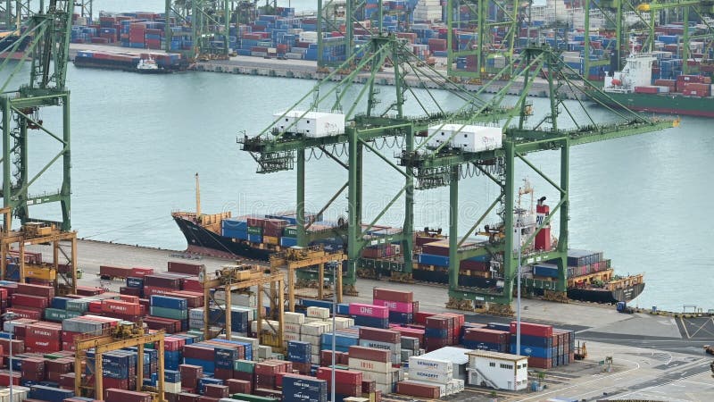 Singapore, Singapore - January 30, 2019 : Time lapse of crane moving container to cargo ship at port