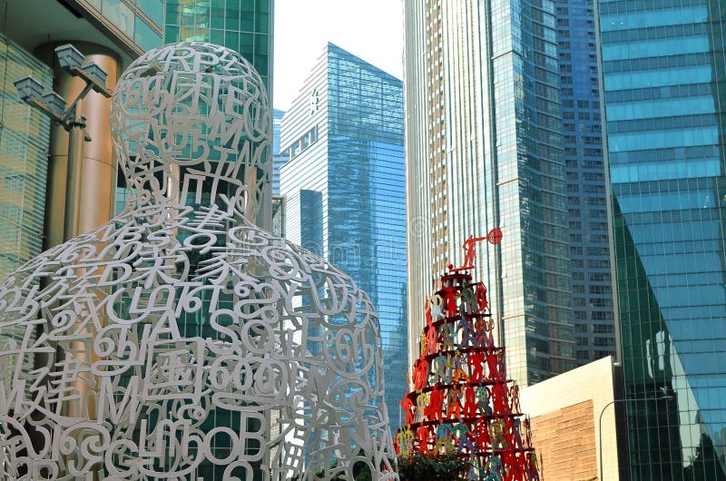 SINGAPORE- MAY 6, 2016 : Skyscrapers office buildings and sculptures of modern megalopolis in Singapore downtown. SINGAPORE- MAY 6, 2016 : Skyscrapers office buildings and sculptures of modern megalopolis in Singapore downtown