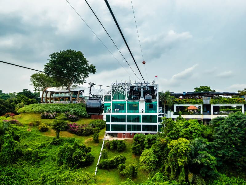 Singapore, Singapore - August 05, 2018: Cable car operating between Sentosa Island and Faber Peak on Mount Faber, over Singapore harbour, Southern Precinct, Singapore, Asia. Singapore, Singapore - August 05, 2018: Cable car operating between Sentosa Island and Faber Peak on Mount Faber, over Singapore harbour, Southern Precinct, Singapore, Asia