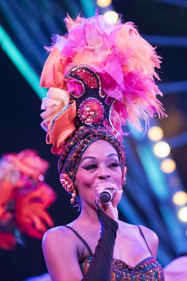 Singer with feather hat and costume in Tropicana, Night Club, Havana. Singer with feather hat and costume in Tropicana, Night Club, Havana