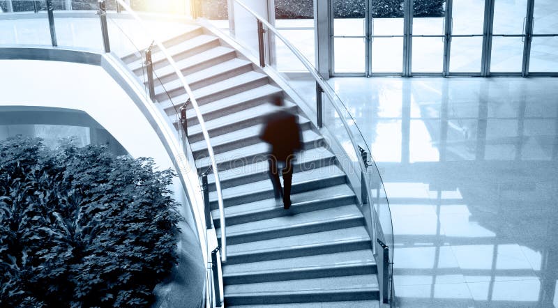 Single business man walking up stairs