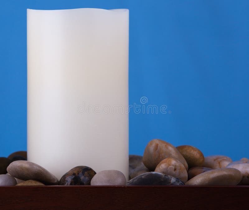 Single Candle and Stones stock photo. Image of tray, white 14290686