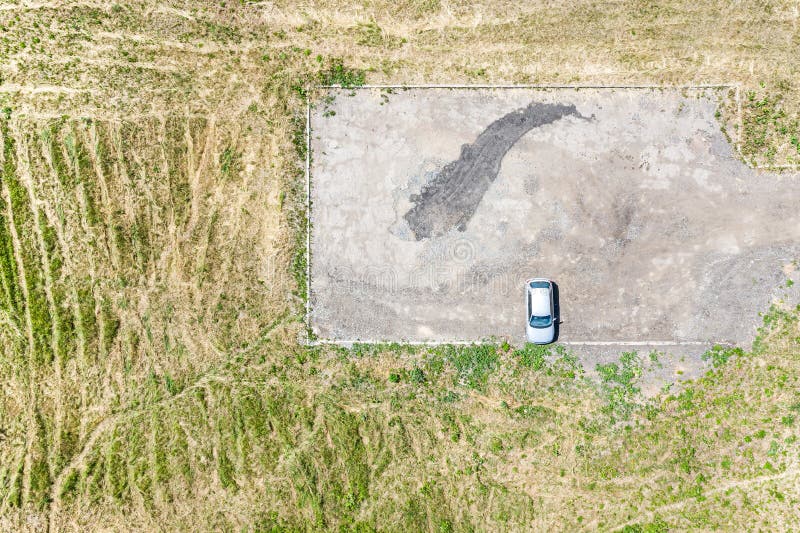 Single car on empty parking lot. aerial view stock image Single car on empty parking lot. aerial view stock image