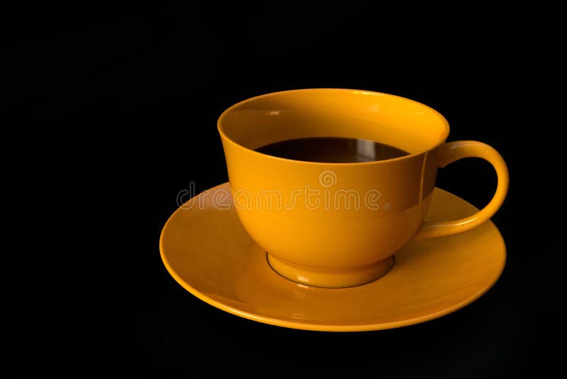 One Coffee Cup, Yellow Ceramic, on Black Background Stock Photo Image