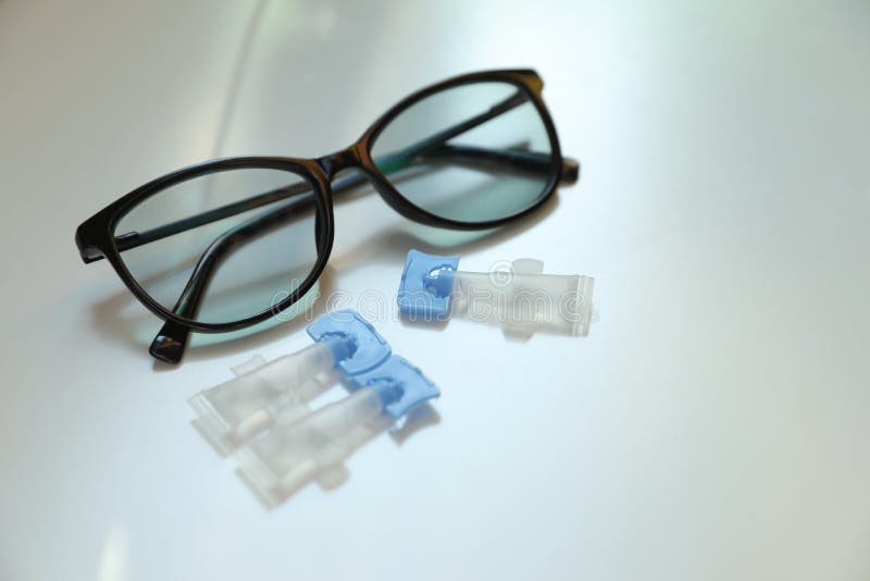 Single Dose Eye Drops and Glasses on White Table Stock Image Image of
