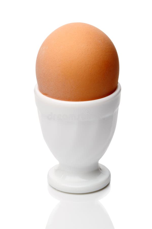 Single egg in cup on white stock photo. Image of whites 18882274