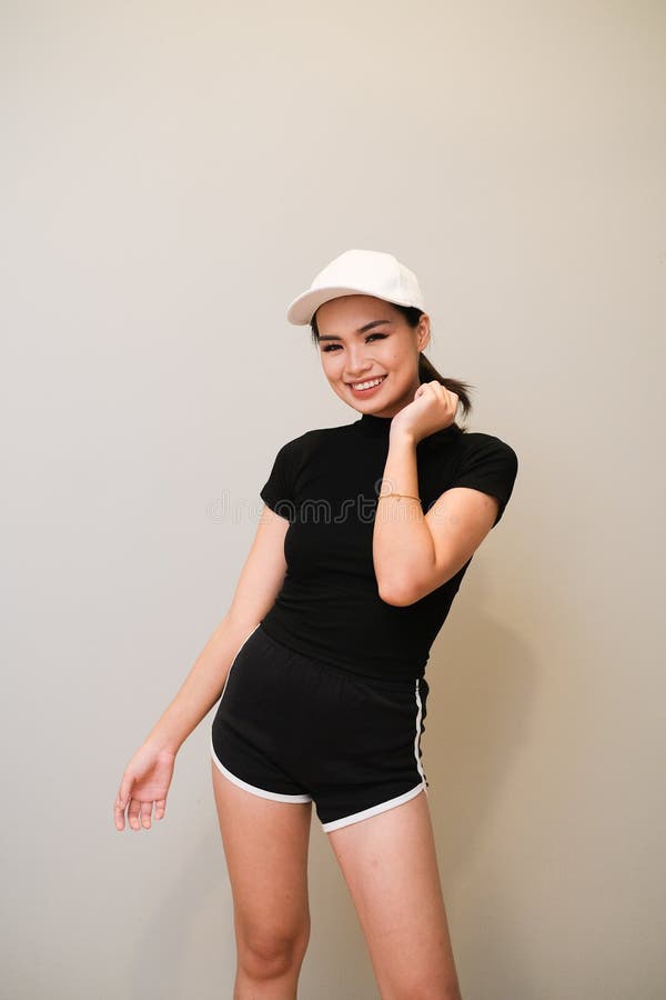 Asian Girl with Nice Outfit, Sportswear with Short Pants and a Cap Stock  Photo - Image of woman, emotion: 152408542