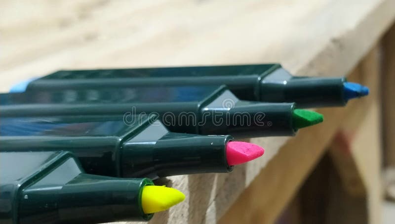 Single highlighter or marker on table. Single neon color beautiful highlighter close up picture on table