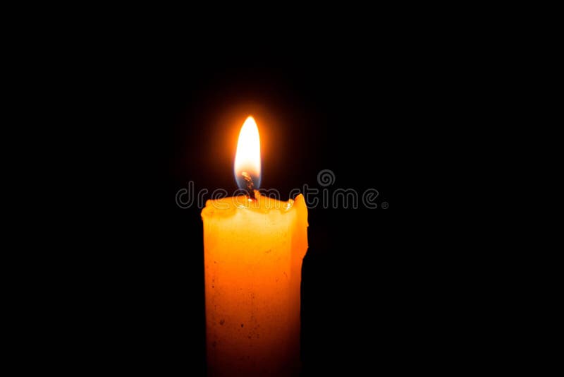 Single lit candle with quite flame royalty free stock photo