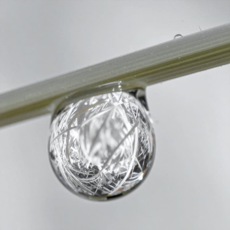 Abstract Water Droplet Reflecting Light on a Blade royalty free illustration