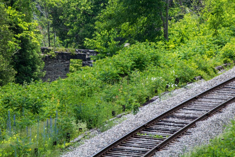 Lonely Railway Passing Old Mill Ruins