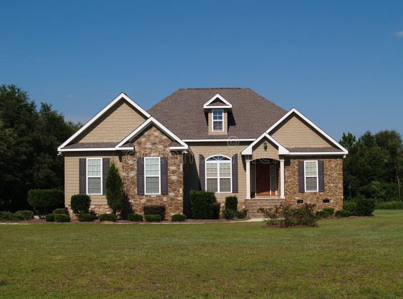 Single Story Stone and Vinyl Residential home