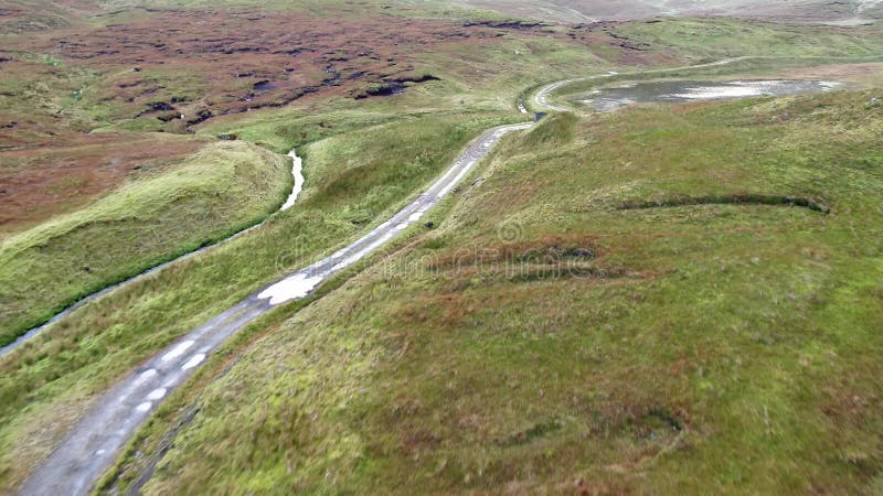 Single track at Loch Cuithir and Sgurr a Mhadaidh Ruadh - Hill of the Red Fox, Isle of Skye, Scotland