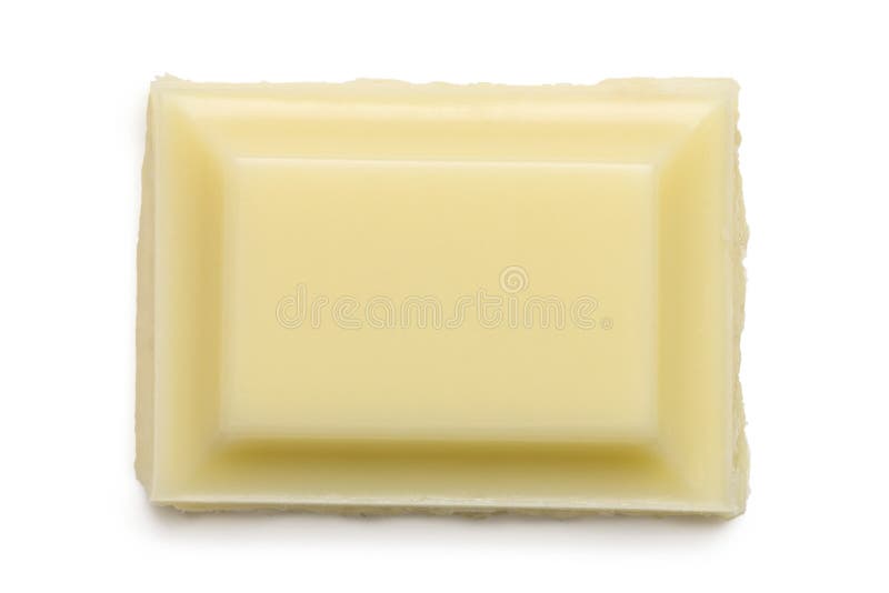 Singolo quadrato di cioccolata bianca isolato su bianco da sopra Bordo approssimativo immagine stock Singolo quadrato di cioccolata bianca isolato su bianco da sopra Bordo approssimativo immagine stock