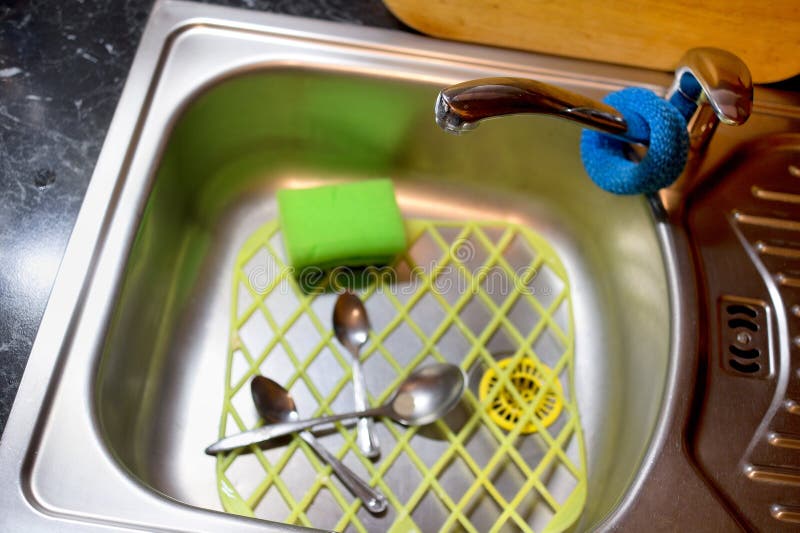 Sink Battery and Sink with Spoons and Sponge Stock Photo Image of