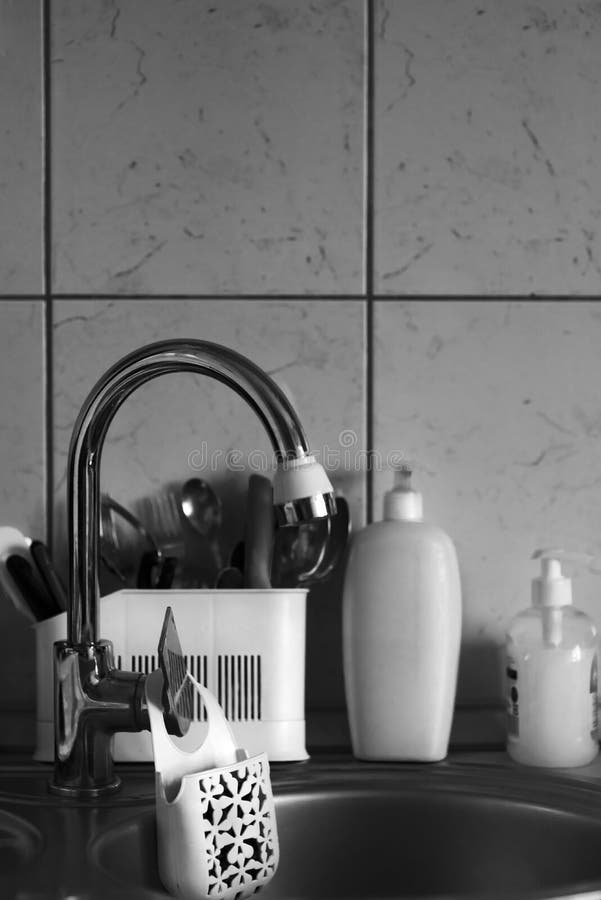 Sink, Faucet and Sponge Support in the Kitchen. Stock Photo Image of