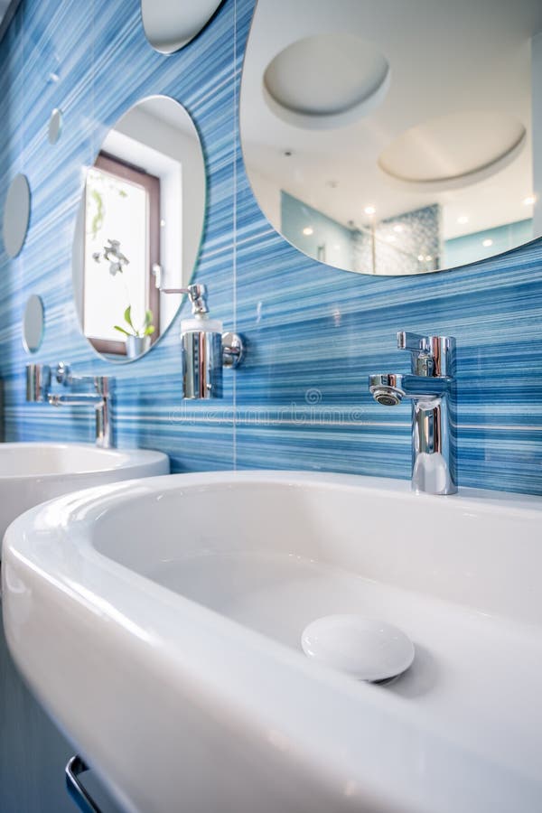 Sink in fun blue bathroom stock image. Image of apartment 98767497